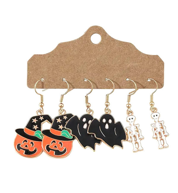 Halloween-themed earrings. three pairs of earrings: one pair with jack-o'-lanterns