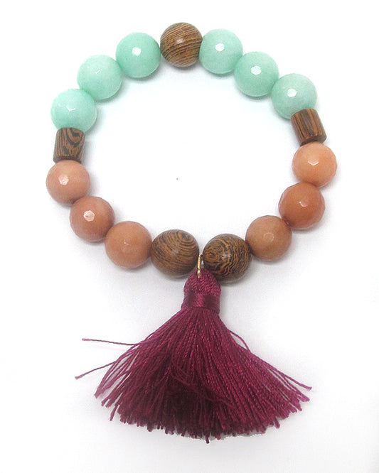 MULTI STONE AND WOODEN BALL TASSEL STRETCH BRACELET